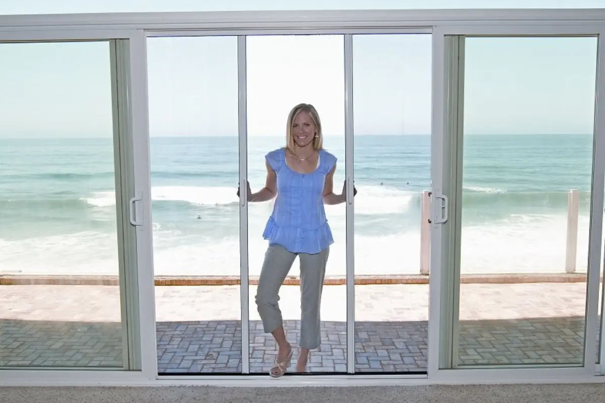 Double retractable screen doors for French door installation